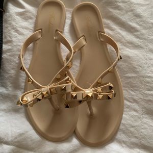 Selling spike out sandals size 7. New